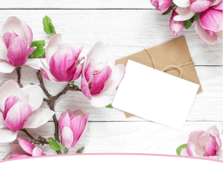 An envelope surrounded by flowers